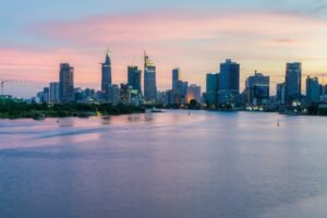 city skyline across body of water during daytime