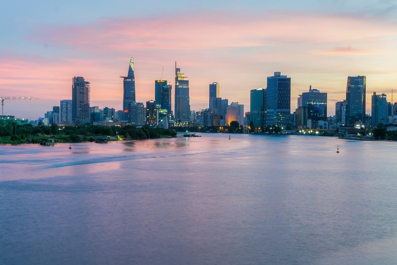 city skyline across body of water during daytime