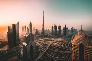 The Burj Khalifa and skyscrapers above a multi-level highway interchange in Dubai