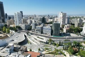 An aerial view of a city with tall buildings