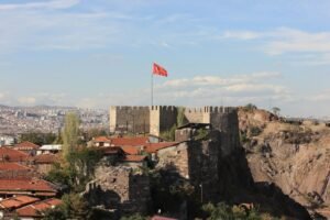 A castle with a flag on top of it