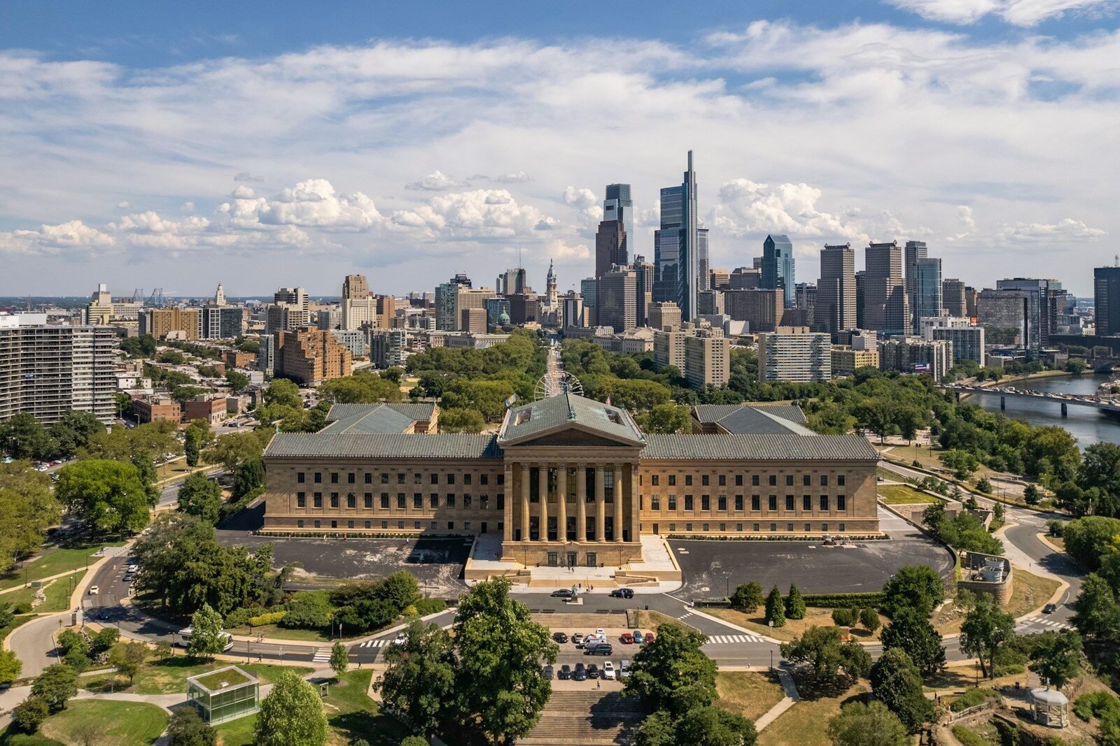 a large building with a city in the background
