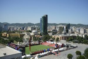 An aerial view of a soccer field in a city