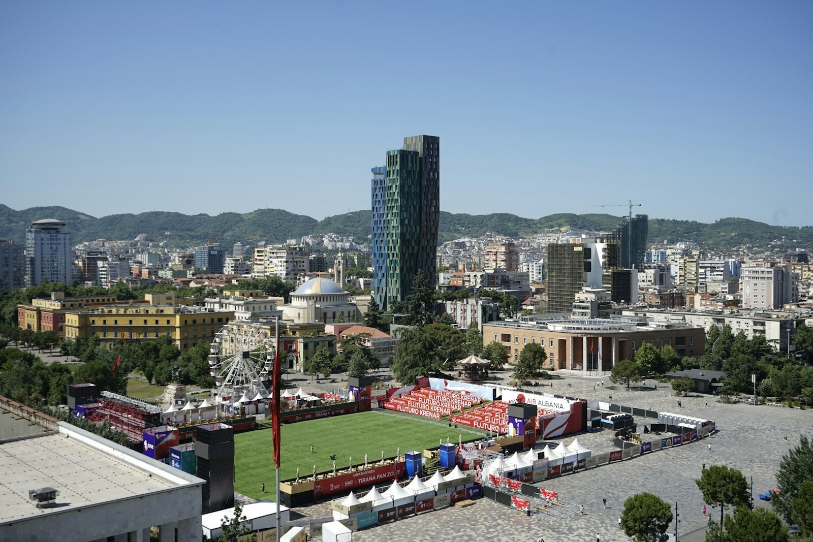 An aerial view of a soccer field in a city